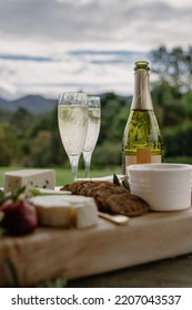 Cheese Platter With Champagne In Countryside