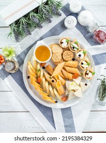 Cheese platter with different cheese and honey Festive gourmet appetizer on the table top view