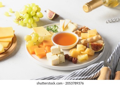 Cheese Platter With Fruits On A White Background. Close Up. Festive Gourmet Snack.