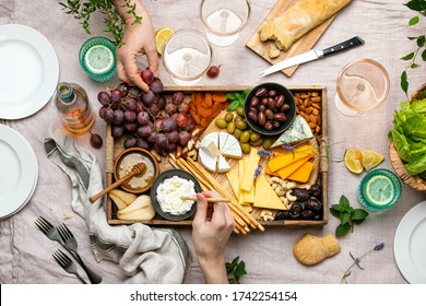 Cheese Platter For Summer Outdoor Party, Top Down View Of Rustic Table Setting With Various Kinds Of Cheese And Rose Wine