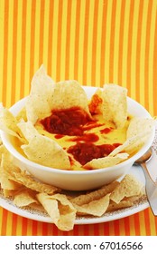 Cheese And Potato Soup With Tortillas And Salsa Added To Create The Hispanic Or Mexican Accent.  Chili Con Queso Dip With Tortilla Chips. (Vertical)