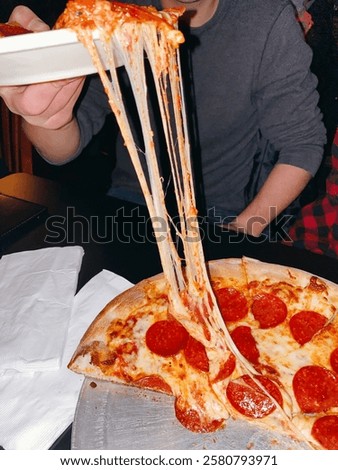 Cheese pull with pepperoni pizza 