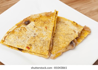 A Cheese Quesadilla  Against A White Background