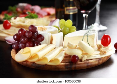 Cheese and salami platter with vegetable and herbs - Powered by Shutterstock