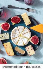 Cheese Selection, Overhead Vertical Shot On A Plate With Fresh Figs, On A Blue Background