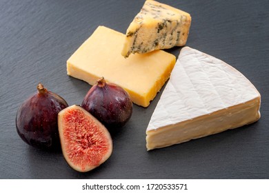 Cheese Selection Tasting And  Food Concept Enjoyment With Mix Platter Of Various Dairy Products And Sliced Figs With No People