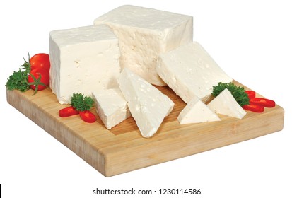 cheese sliced on a wooden board