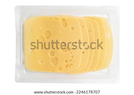 cheese slices isolated on white background, sliced cheese in plastic package, pieces of sliced gouda cheese laid out to create layout