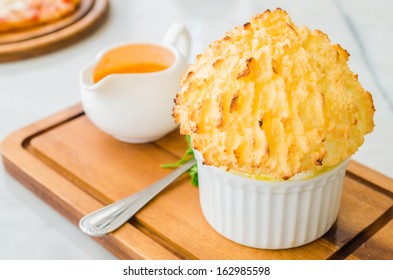 Cheese Souffle Served With Pink Brandy Sauce