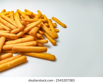 Cheese stick biscuit with copy space. cheese atick biscuit isolated on white background. Savory biscuits. Cheese baked biscuits. cheesecake. stack of yellow biscuit. - Powered by Shutterstock