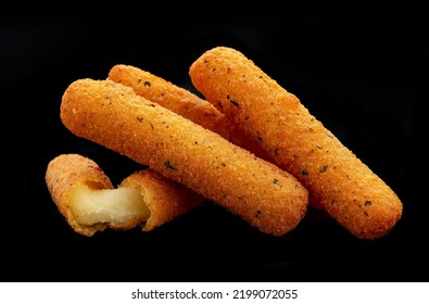 Cheese sticks on the black background. Photo for the menu