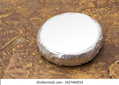 Cheese Top Hat In Silver Foil Mockup. Mockup For Burger, Butter And Other Products. Brown Background. Product Template