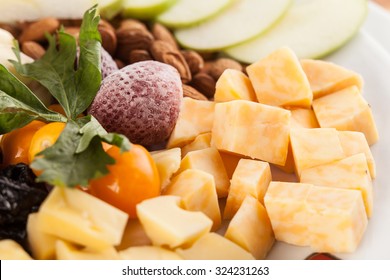 A Cheese Tray With Fruit Food Party