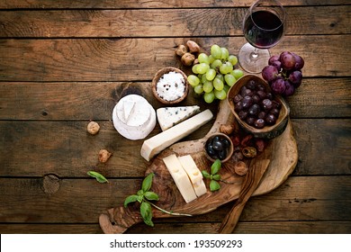 Cheese variety. Food background.  Fresh ingredients on wood - Powered by Shutterstock