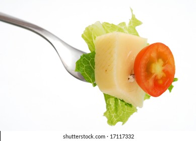 Cheese And Veggies Picked With Fork Isolated On White