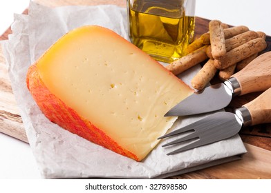 Cheese Wedge Menorca In Spain, With Bread Sticks And Oil