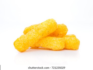 Cheese yellow corn snacks closeup on white background