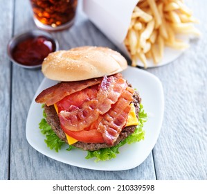 Cheeseburger With Bacon And French Fries Shot Overhead