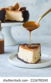 Cheesecake With Caramel Sauce, Piece Of Delicious Cake. Salted Caramel Sauce Poured On Slice Of Pie