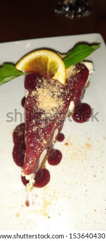 Cheesecake decorated portion on table, a delirious tasty cheese cake