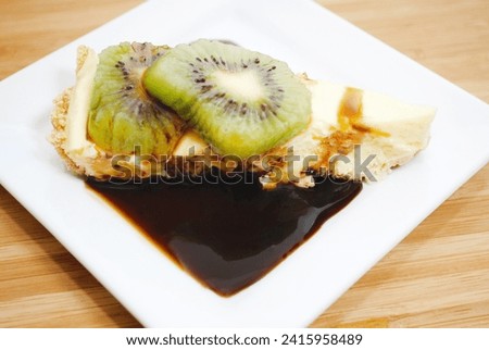 Cheesecake with Kiwi and Caramel Syrup
