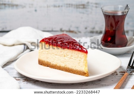 Cheesecake. New York cake. Raspberry cheesecake on wood floor background. close up