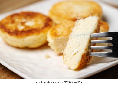 Cheesecake On A Fork, Appetizing With A Golden Crust. 