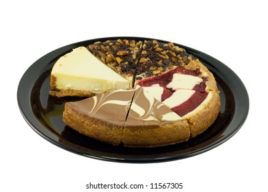 Cheesecake Sampler With Four Types Of Cheescake On A Black Plate