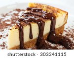 Cheesecake slice with melted and crushed chocolate