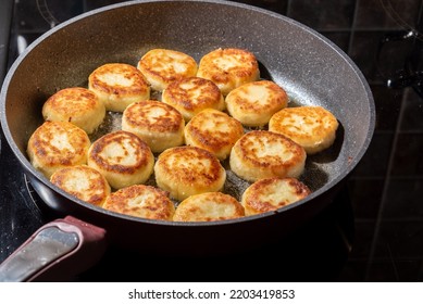 Cheesecakes Or Syrniki On A Pan. Russian And Ukrainian Cuisine