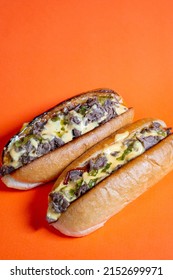 Cheesesteak With Cheese Sauce And Sweet Pickle Relish, Closed Up Orange Background