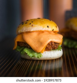 Cheesy Chicken Slider Burger On Wooden Table