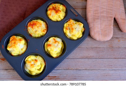 Cheesy Mashed Potatoes With Brown Napkin And Grove On Wood Table,top View For Copy Space