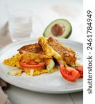 Cheesy Omelette toast breakfast with tomato and avocado