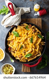 Cheesy Pasta Bake In A Pan With Ground Beef And Herbs Overhead Shot