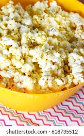 Cheesy Popcorn In A Yellow Bowl