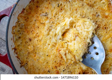 Cheesy Potato Hash Browns In Cast Iron Dish Flat Lay