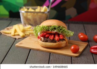 Cheetos Beef Burger On Wood Table