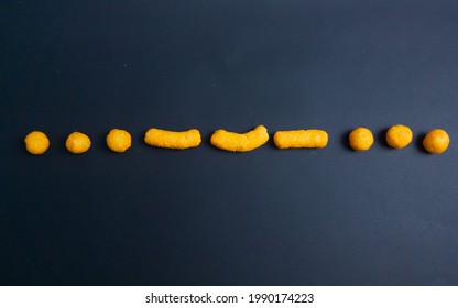 Cheetos Snack Making Morse Code Of SOS Sign In Black Paper