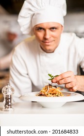 Chef Adding Final Touch To Delicious Salad