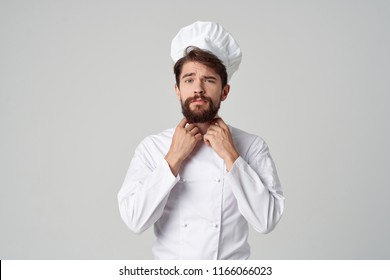  Chef With A Beard Corrects A Uniform                             