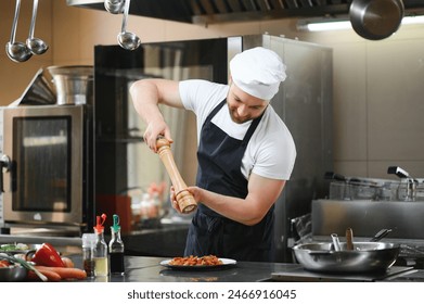 Chef of a Big Restaurant Prepares Dishes. Modern Kitchen is Made of Stainless Steel and Full of Cooking Ingredients. - Powered by Shutterstock