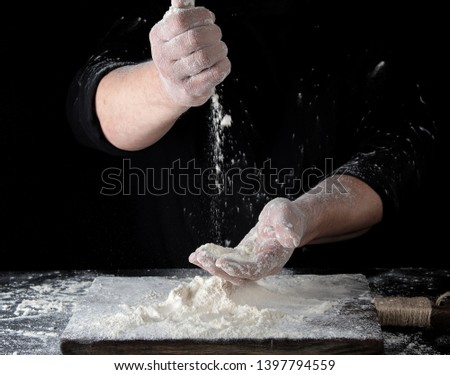 Similar – Image, Stock Photo man sifts white wheat flour through a wooden sieve