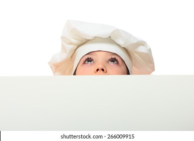 Chef Boy Looking Up From Behind The Wall Isolated On White Background  