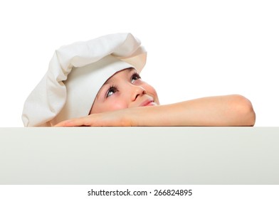 Chef Boy Looking Up From Behind The Wall Isolated On White Background  