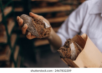 Chef Breaking Freshly Baked Sourdough Bread - Powered by Shutterstock