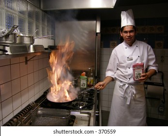 Chef with burning flames - Powered by Shutterstock