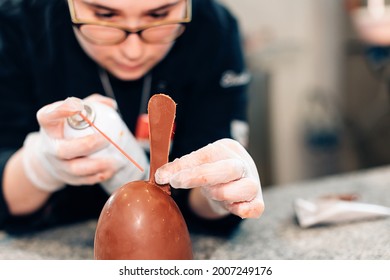 Chef Chocolatier Working Inside Pastry Artisan Workshop - Focus On Chocolate Egg