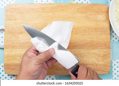 Chef Cleaning Knife With Paper / Cooking Coleslaw Concepted