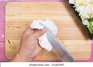 Chef Cleaning Knife With Paper / Cooking Yakisoba Concept